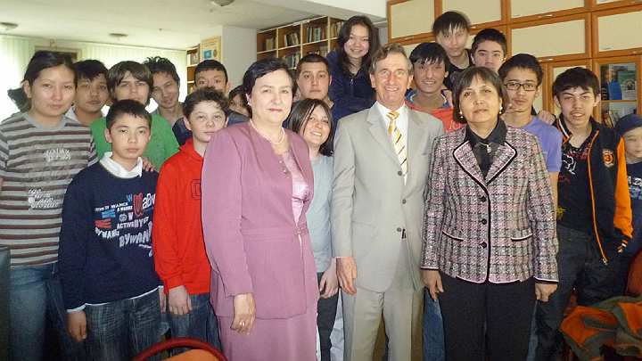 Kazakhstan-3.jpg - 19 January 2011Kazakhstan: Dr Deans and a teacher of the Transcendental Meditation Programme with the principal and students of a school.