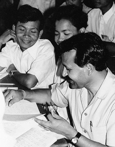 HisExcellencyChandraBhandariwithStudents.jpg - His Excellency, Chandra Bandari, the Indian Ambassador to Cambodia, speaks with students in 1994. He was instructed in Transcendental Meditation in 1967 by Maharishi and wrote the forward to the book, Maharishi Vedic University in Cambodia: Educational Reconstruction and Social Renewal.