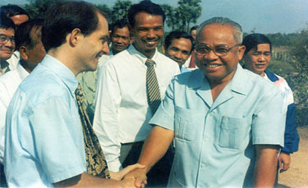 HisExcellencyCheaSimGreetingMVUFaculty.jpg - 1994: The Cambodian Minister of Education, His Excellency Chia Sim greeting faculty of Maharishi Vedic University. Dr Fergusson, at left, said the Cambodian government officials and other institutions have high regard for how MVU improves the lives of students and creates peace in the region.