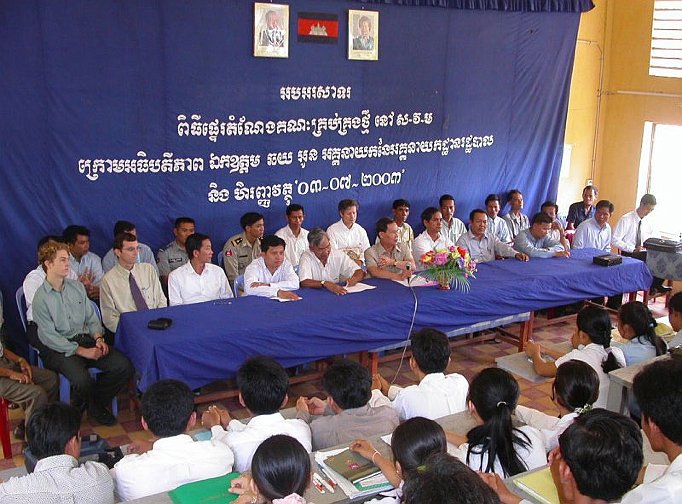 slide21.jpg - Faculty in main lecture hall speaking to students attending Maharishi Vedic University in Cambodia in 2006.