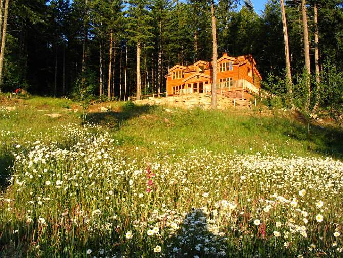 005Global-County-House.jpg - Salt Spring Island has the largest collection of Vastu homes in Canada. This two-storey home, gracefully set in a forest with idyllic surrounding meadows, is constructed of cedar and other indigenous west coast woods.