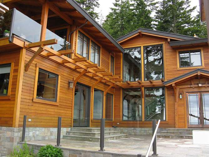 009Large-home.jpg - With 4,000 square feet (372 square metres) of living area, this Maharishi Vastu home features clear cedar wood, harvested locally, and a copper roof. Nestled in the forest, the surrounding views can be taken in from all sides of the house.