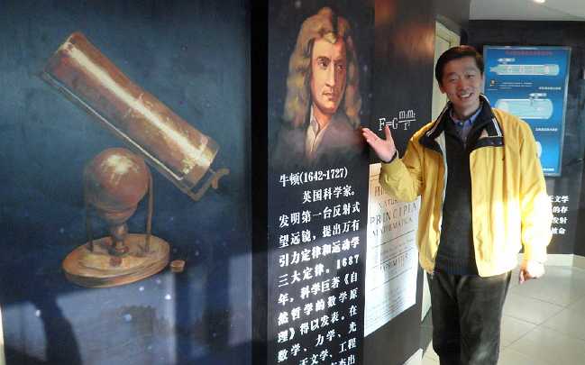 18China.jpg - The science hallway is shown by an educator who has been instrumental in maintaining relations with organizations that arrange and help students attend MSAE.