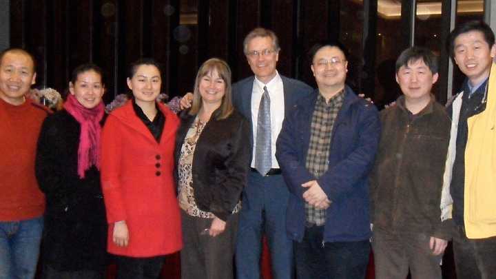 28China.jpg - Following a presentation on Consciousness-Based Education Drs Richard and Andrea Beall stands with parents, supporters and the father of a kindergarten program that has 600 employees in the province standing to the right of Richard Beall.