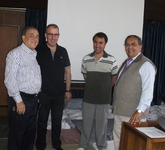 39_Columbia.jpg - 7 August 2012Father Gabriel Mejia, left, founder of the Hogares Claret schools, with Dr Pedro Ojeda, far right, administrator of Maharishi's technologies through Latin America, with teachers of Transcendental Meditation at Hogares Claret schools.