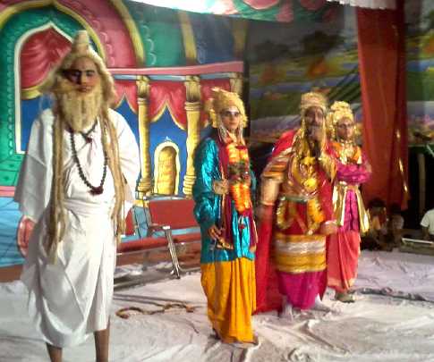 13.jpg - Maharishi Nagar, Uttar Pradesh: Ram Lila, the story of consciousness and the Veda, was played by artists during the celebration of Kanya Bojan. This is a traditional  festival in which young girls traditionally receive gifts, special food, and honours from their family.