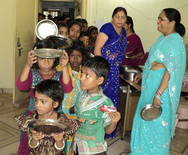 India_24.jpg - 3 July 2012 reportMaharishi Nagar, Noida: Ladies of the Global Mother Divine Organisation prepare for a traditional Vedic celebration in the spring called Kanya Bhoj, where girls are honoured, receive gifts, and dine together.
