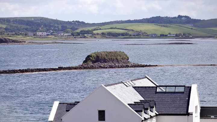 09Ire.jpg - 27 August 2014 This land mass looks like a submarine, but in reality it one of the 356 islands in Clew Bay. When the tide is out some of the islands, like this one, surface.