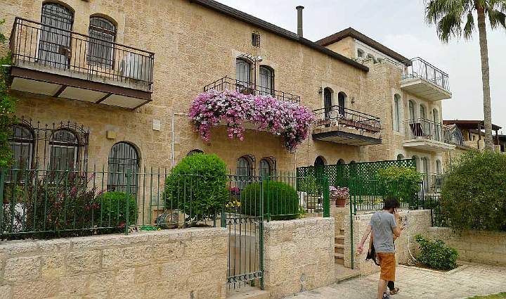 Israel-113s.jpg - In Jerusalem the exterior of all residential buildings is required to be constructed from a specific stone called ?Jerusalem stone? so they have a uniform orderly fa�ade.