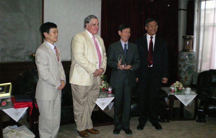 67_Bevan.jpg - The president of Beijing Language Culture University invited Dr Bevan Morris, President of Maharishi University of Management, to attend the 50th anniversary celebration of the university. On the occasion Dr Morris presented his host with a copy of Dr Craig Pearson?s book Yogic Flying.