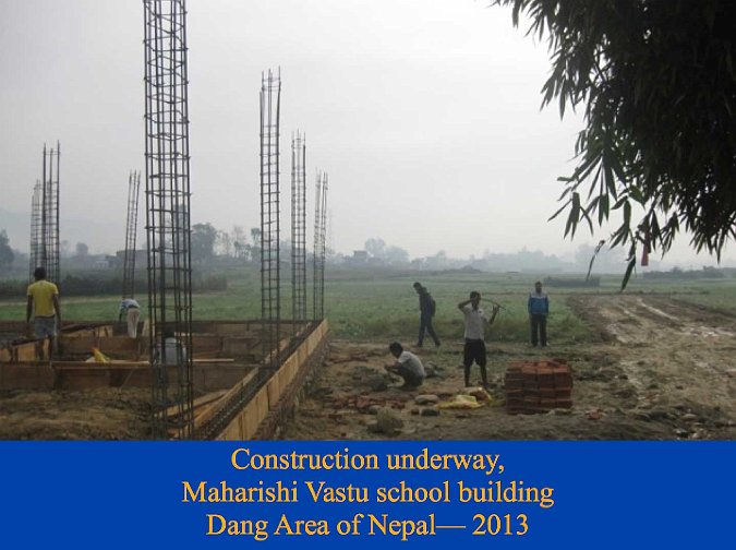 025.jpg - Construction of the new Maharishi Vastu school building is underway in the Dang area of Nepal. With the foundation and the cornerstone properly set, the walls are going up.