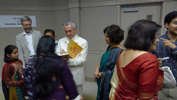 26.jpg - After the lecture Dr Tony Nader signed copies of his new book, Ramayan in Human Physiology, which was released while he was on tour. Dr Howard Chancellor is standing to Dr Nader?s left.