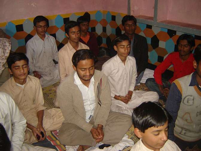 During-Group-meditaion.jpg - During a recent visit to a village 40 people learned Transcendental Meditation. Daily they practise as group, and once a week they connect to the Kumars by cell phone to share experiences. Several in the group are schoolteachers and have requested that the Kumars return in order to teach all the children in the village.