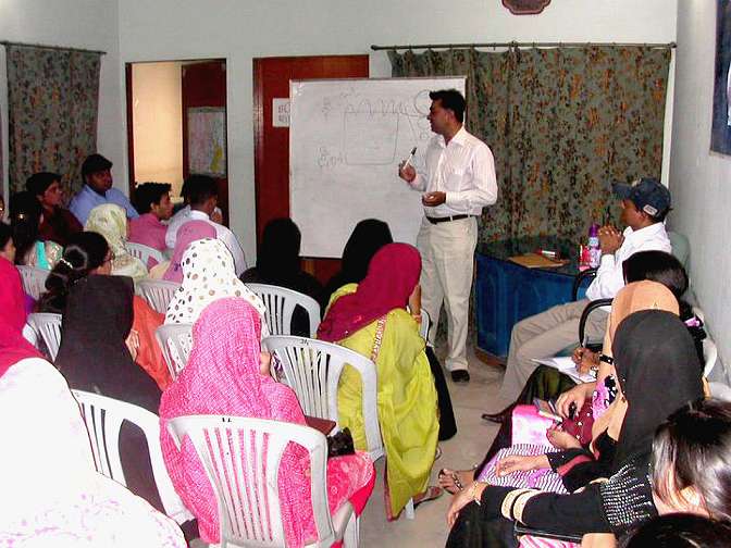 at-american-language-centre.jpg - At an American Language Centre lecture in Pakistan Dr Kumar introduces Transcendental Meditation.  People from all professions have learned the technique, including doctors and well-known hospital consultants from a top medical university hospital in Karachi.