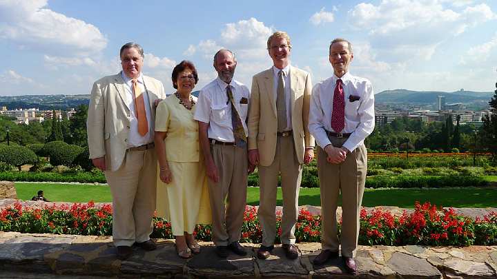 SouthAfrica117.jpg - Standing outside the President?s Palace in Pretoria, in front of the beautifully landscaped gardens, are, from left, Dr Bevan Morris, Anise Anema, Kolbe Anema, Steve Brittingham, and Dr Richard Peycke.