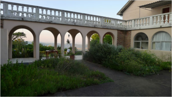 southafrica360.jpg - One feature of the beautiful architecture of the academy can be seen here in a covered outdoor dining area with a second story balcony providing shade.