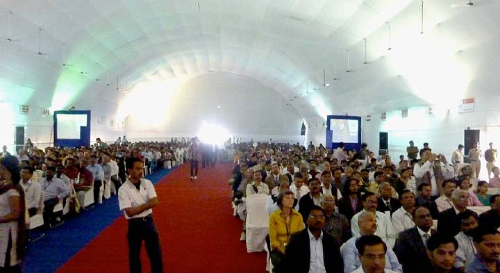 Slide08.jpg - A large audience filled the hall and listened intently to the presentation.