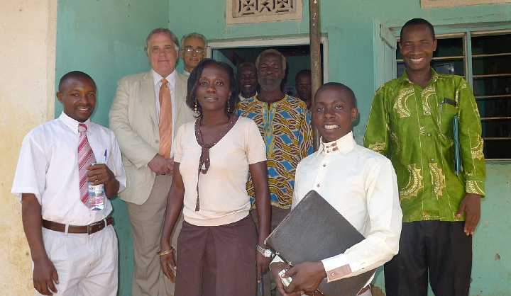 Uganda-GGn-(29).jpg - Tsongo Bamande, Dr Morris, Dr de Freitas, Judith Nassali, community leaders, John Bukenya, and Mark Mugabe at the administrative office for EDAPO--the Economic Development and AIDS Prevention Organization.