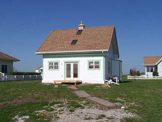 59.jpg - Maharishi Vedic City, Iowa: This is the smallest house in the first Vastu community built in the world. It is 60 square metres (645 square feet) downstairs, plus a small upstairs room. Warmer weather will allow completion of porch and walk.